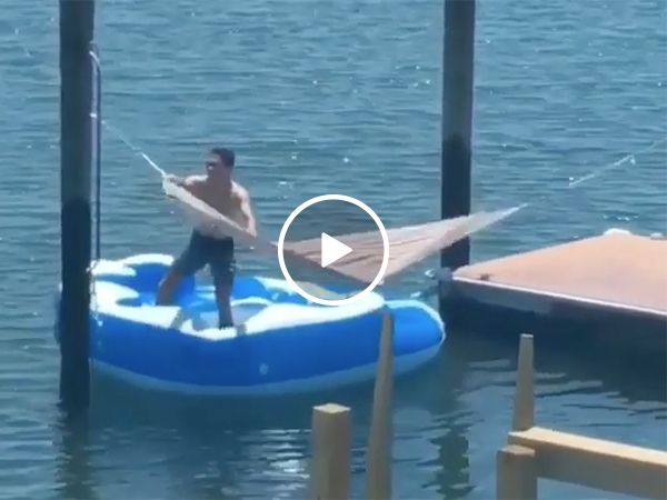 Guy Tries To Get In Hammock On Lake And Falls In the Water