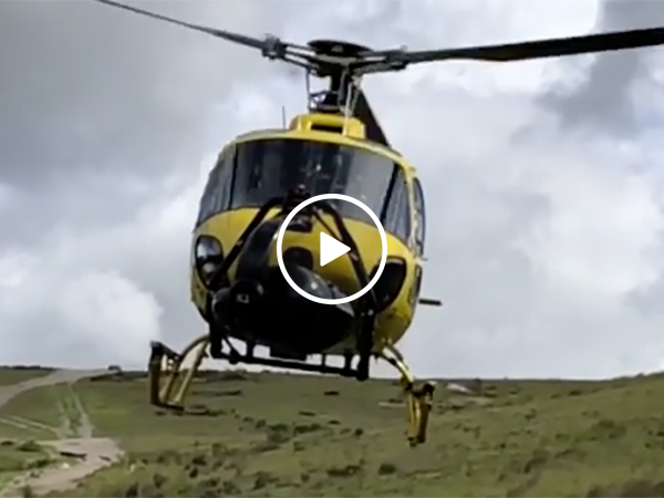 Helicopter Stuntman Films Right Under A Moving Aircraft