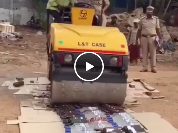 Steamroller crushes Bottles of Grey Goose and Vodka and Whiskey