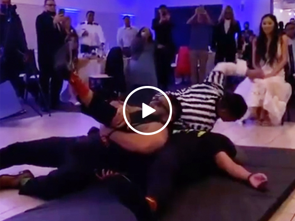 Groom channels The Rock at his WrestleMania wedding?! (VIDEO)