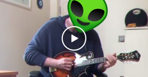 Eerie 90s theme shredded on the mandolin by guy in socks and sandals (Video)